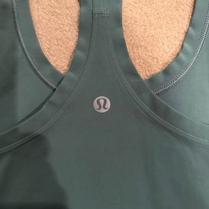 Stretch tank Lululemon fits like a 4 and was shortened 1 inch.